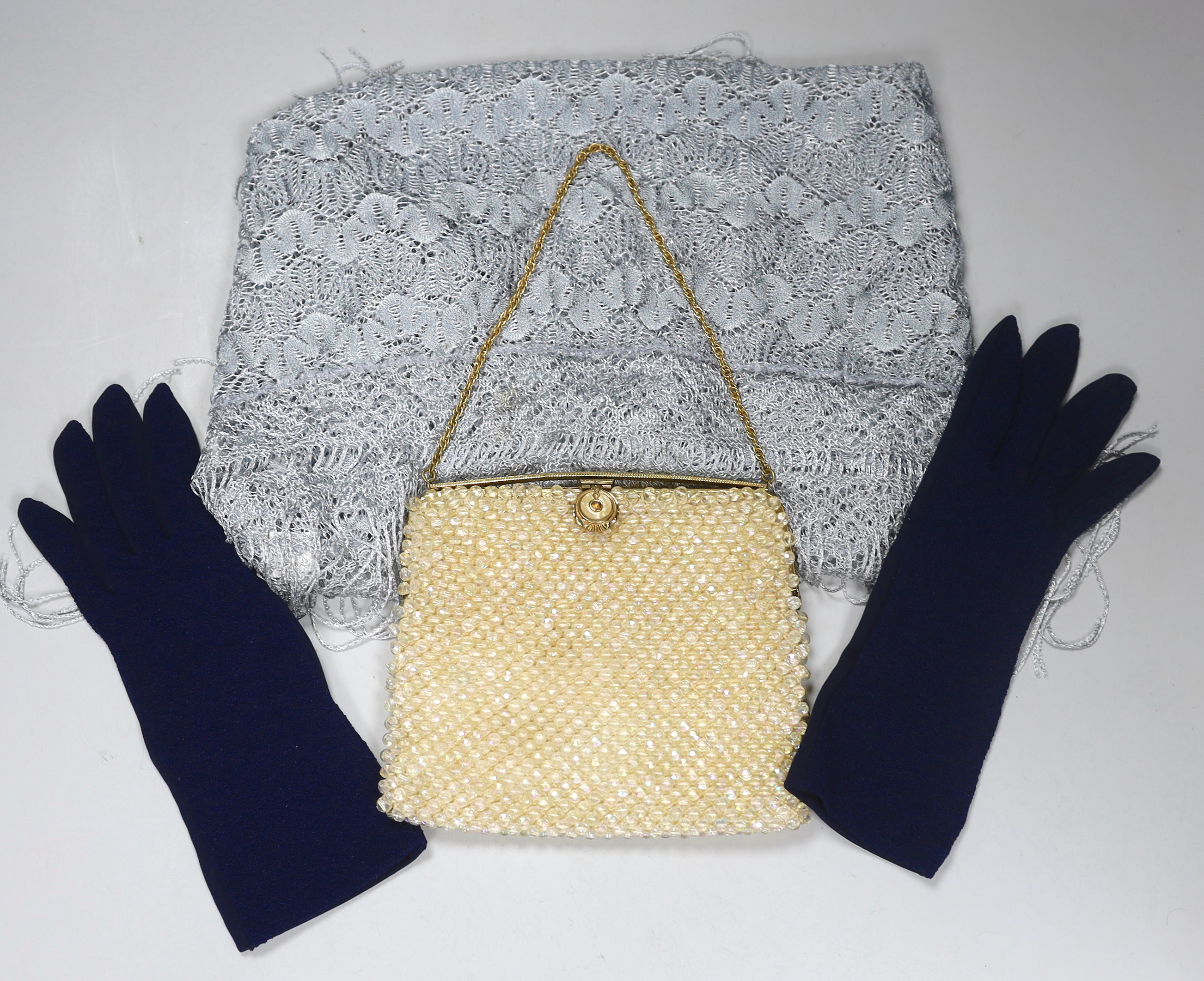 An evening purse, a shawl and pair of blue gloves